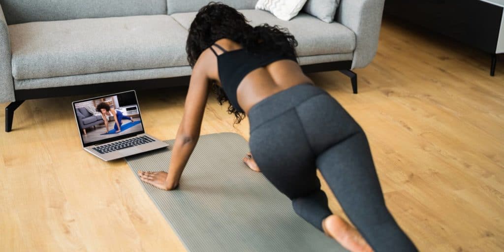 woman doing personal training workout online