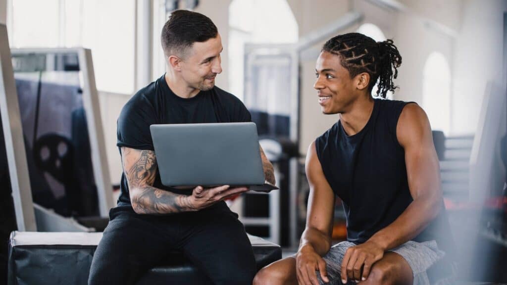 personal trainer selling services to client